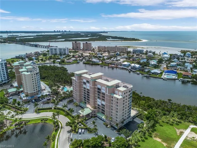 Birds eye view of property featuring a water view