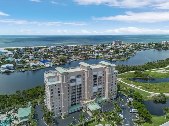 Birds eye view of property with a water view
