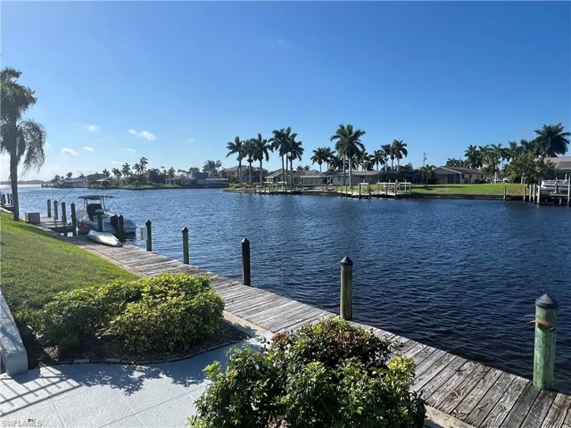Dock area featuring a water view