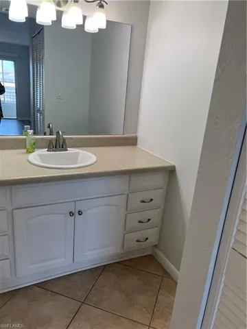 Bathroom featuring vanity and light tile patterned floors