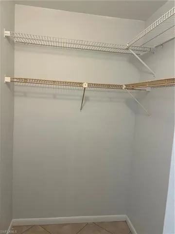Walk in closet featuring light tile patterned floors