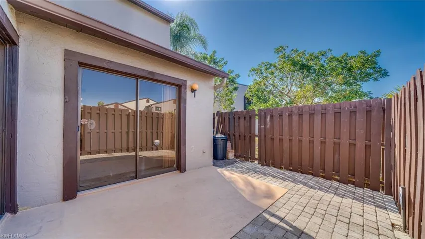Fenced backyard featuring a patio