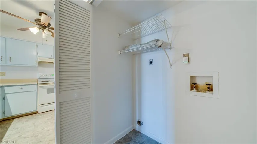 Laundry area featuring ceiling fan, hookup for an electric dryer, and hookup for a washing machine