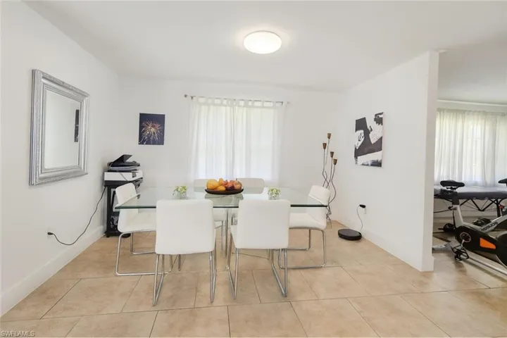 Dining space featuring plenty of natural light and light tile patterned flooring