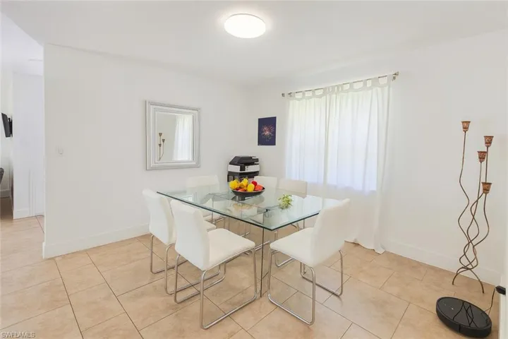 Dining area featuring light tile patterned floors