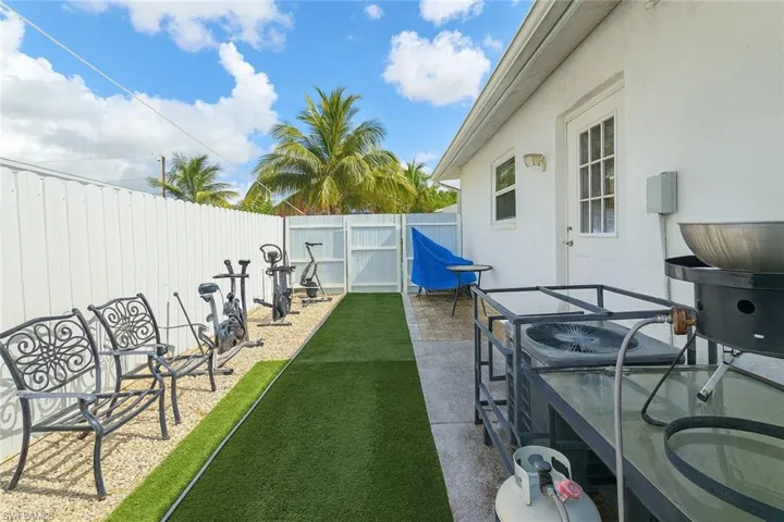 Fenced backyard featuring a patio
