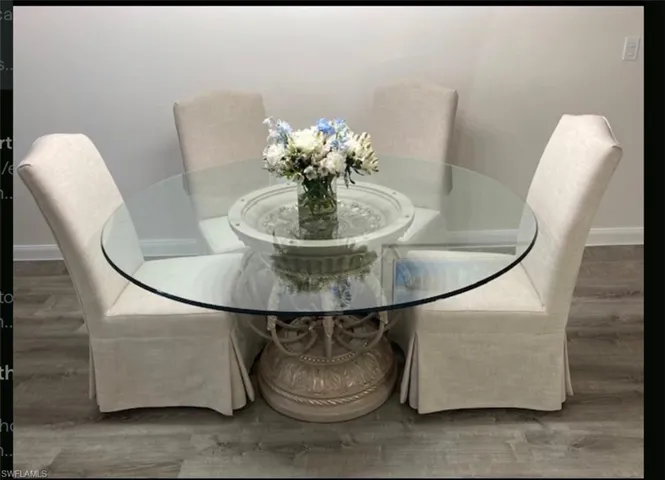 6 chairs total . Round glass table with solid base.