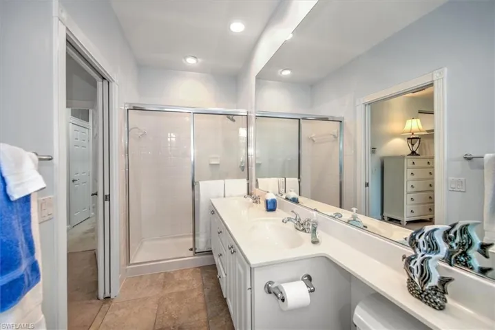 white cabinetry and Sep tub and shower other side upper main suite with balcony