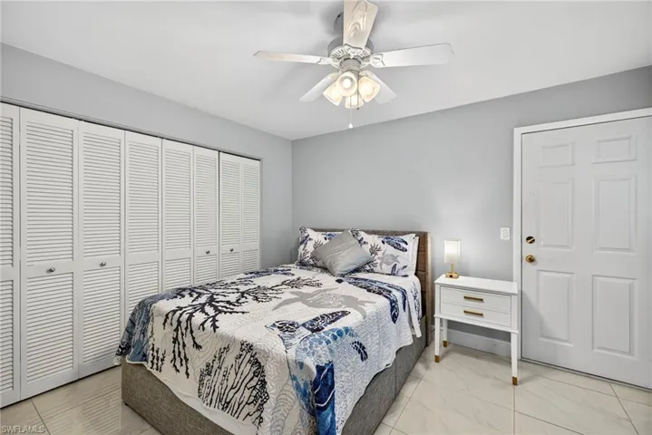 Bedroom featuring a closet and a ceiling fan