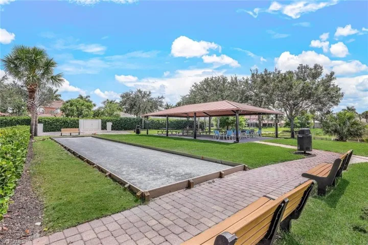 Surrounding community with a lawn and a gazebo
