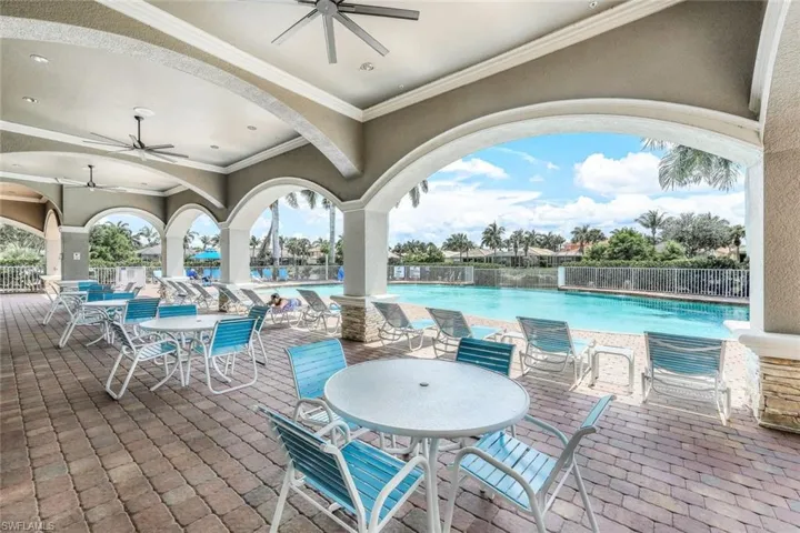 View of patio / terrace featuring a community pool and ceiling fan