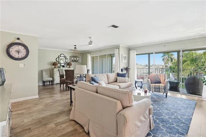 Living area featuring crown molding