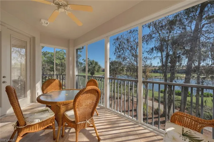 Sunroom with a water view