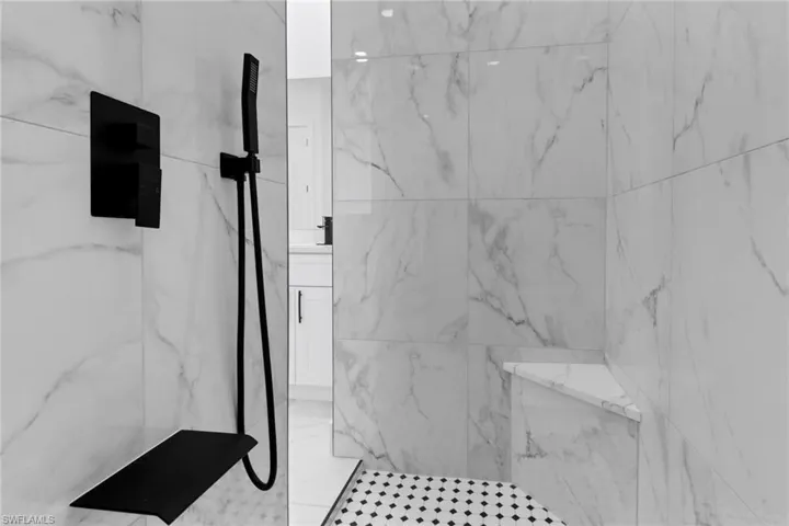 Full bathroom featuring a marble finish shower