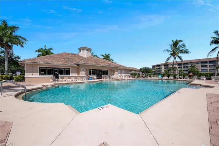 Community pool featuring a patio
