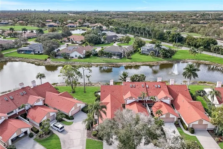 Aerial perspective of suburban area featuring a large body of water