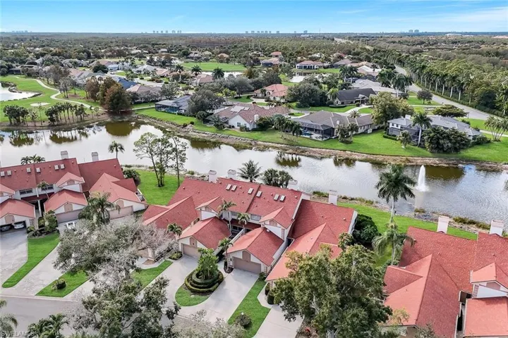 Aerial perspective of suburban area with a large body of water