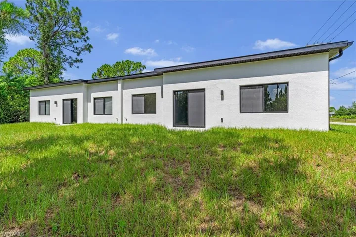 Contemporary exterior with white stucco finish