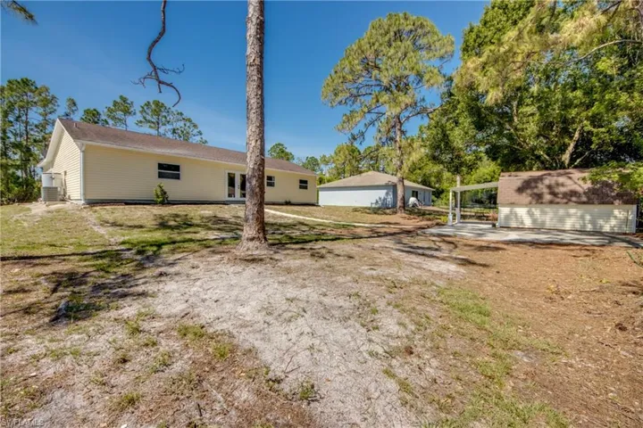 View of yard with a detached garage