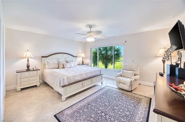 Master Bedroom with baseboards and ceiling fan