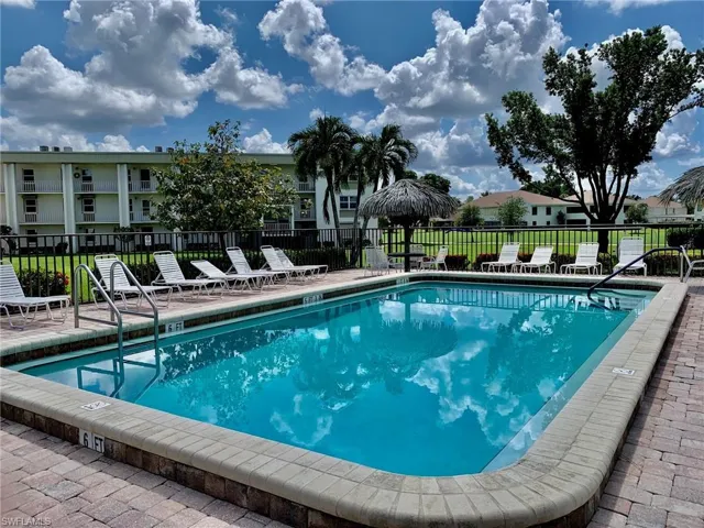Community pool with a patio area