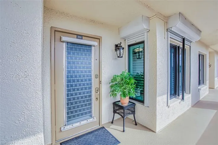 View of exterior entry featuring stucco siding