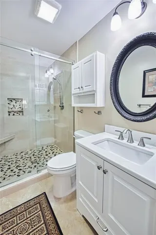 Master bath with vanity and a stall shower