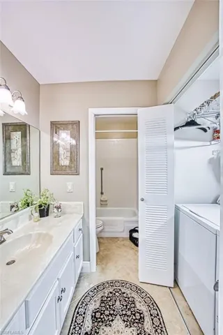Bathroom featuring vanity and bathing tub / shower combination
