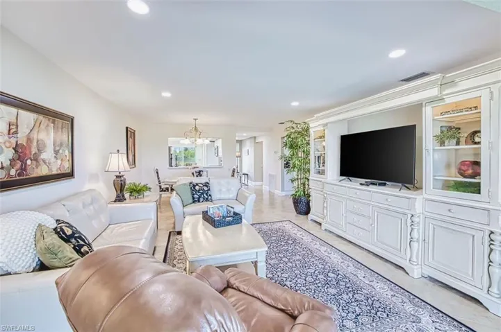 Living room with suspended lighting