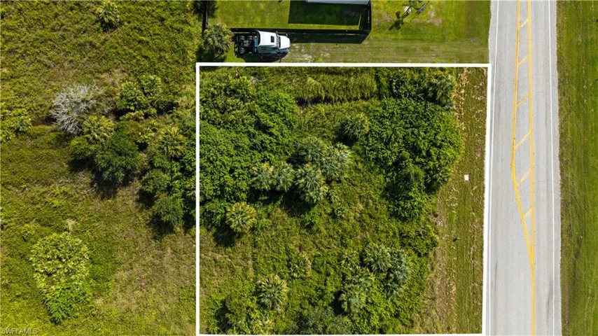 Aerial overview of property's location featuring property parcel outlined