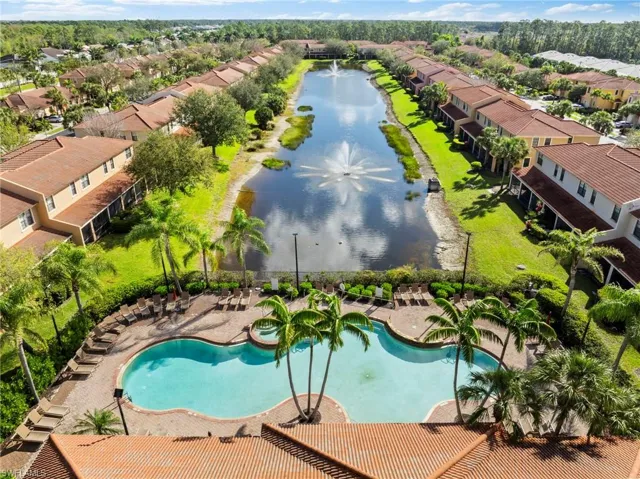 Drone / aerial view with a water view and a residential view