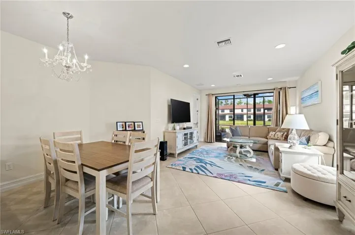Dining area featuring recessed lighting, visible vents, a notable chandelier, and light tile patterned floors