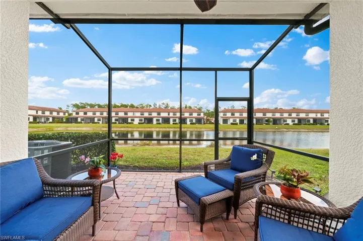 Sunroom / solarium with a water view and plenty of natural light