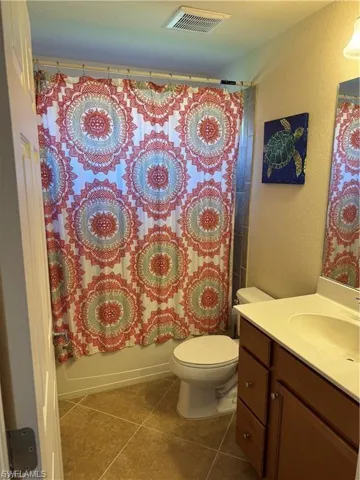 2nd Bathroom with vanity, tile floors, and shower / bath combo,
