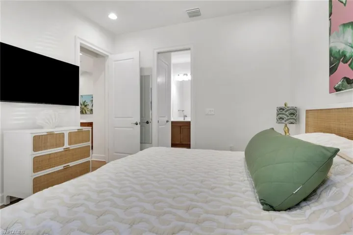 Master Bedroom featuring ensuite bathroom and recessed lighting