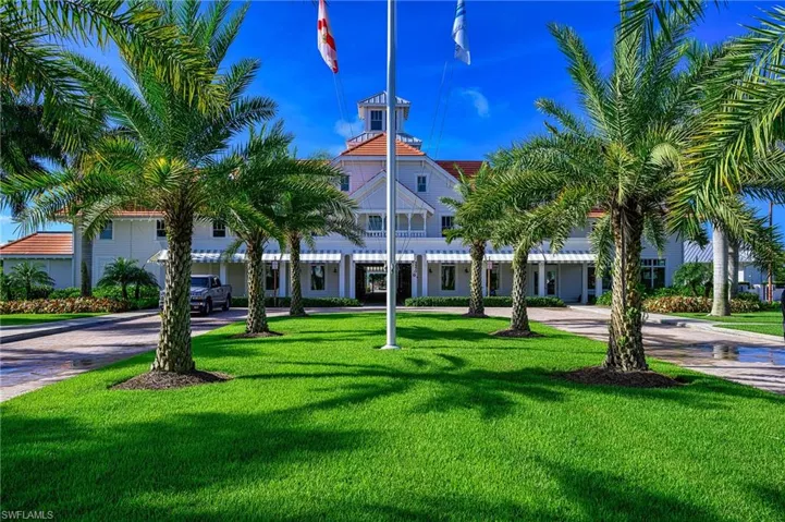 View of building exterior featuring curved driveway
