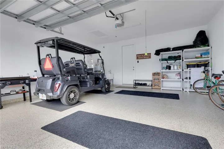 2 Car Garage featuring a garage door opener