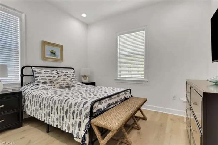 Guest Bedroom featuring light wood-style flooring and recessed lighting