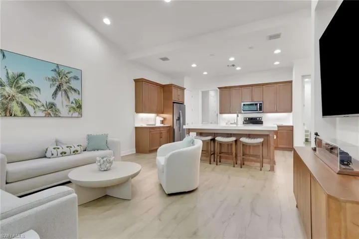 Living area with recessed lighting and light wood-style floors