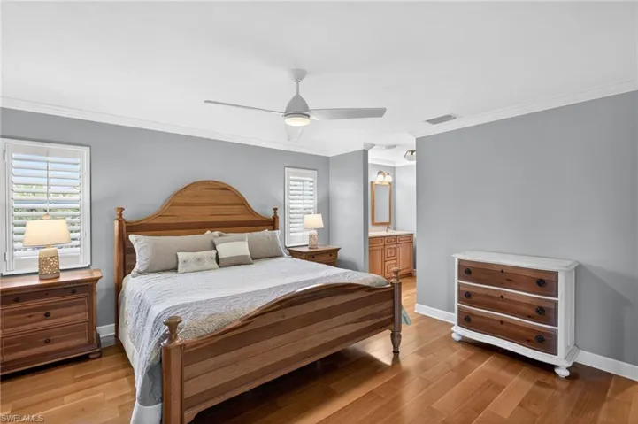 Bedroom featuring wood-finish flooring and light gray walls