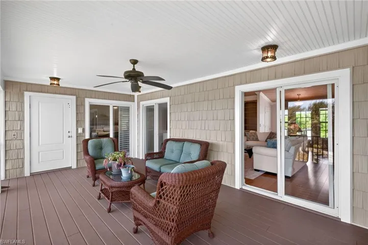 Covered outdoor patio featuring composite decking and beadboard ceiling