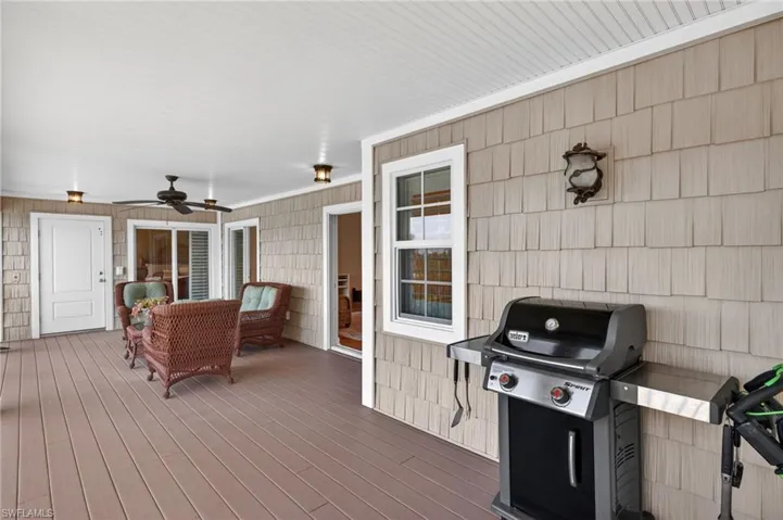 Covered outdoor living space featuring composite decking