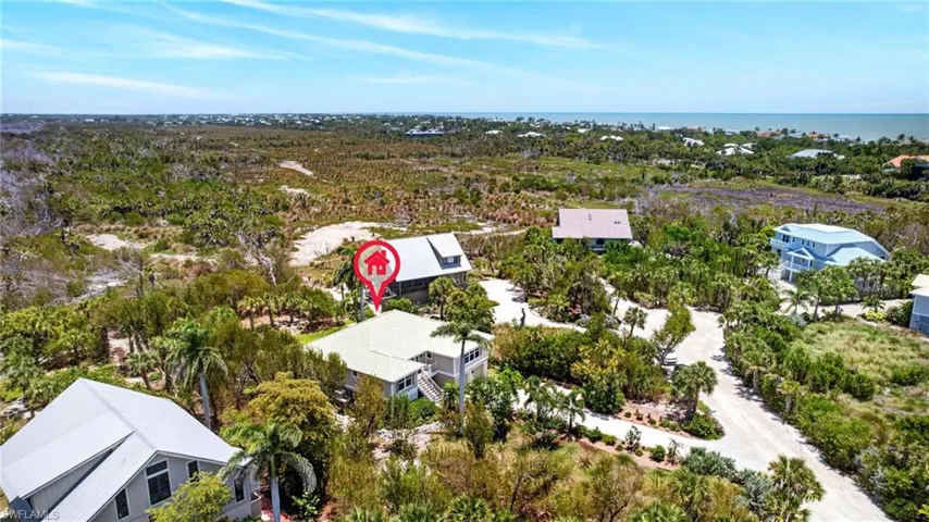 Aerial perspective highlighting a single-family residence with a light-colored roof
