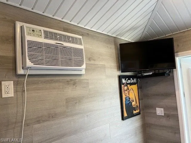 Detailed view of wood walls and a wall mounted AC