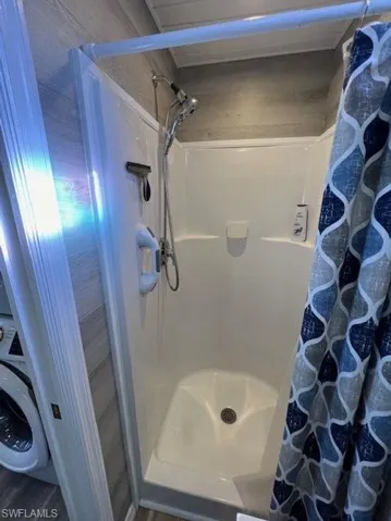 Bathroom featuring a shower stall