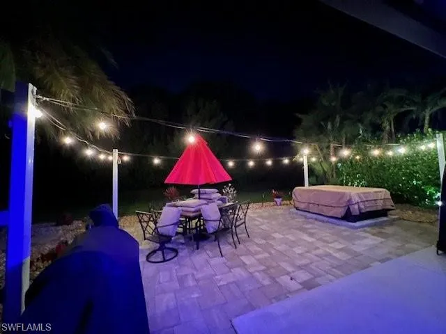 Patio at twilight featuring a patio area and outdoor dining area