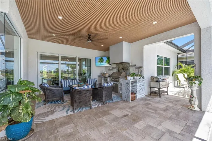 View of patio / terrace featuring outdoor dining space, area for grilling, ceiling fan, and grilling area