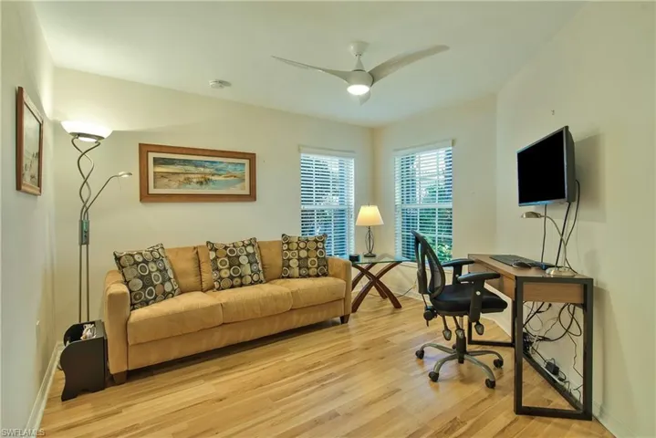 Home office featuring light wood-type flooring and ceiling fan