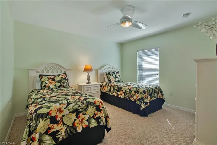 Bedroom with carpet and ceiling fan