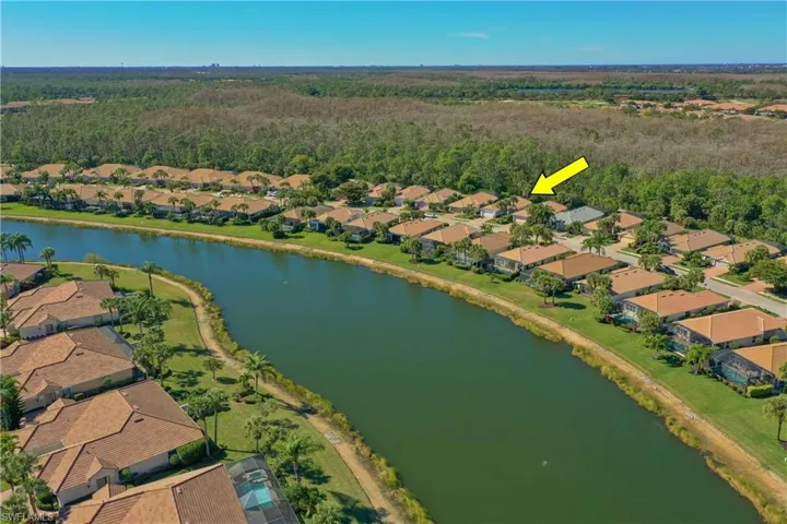 View of property location with nearby suburban area and a large body of water